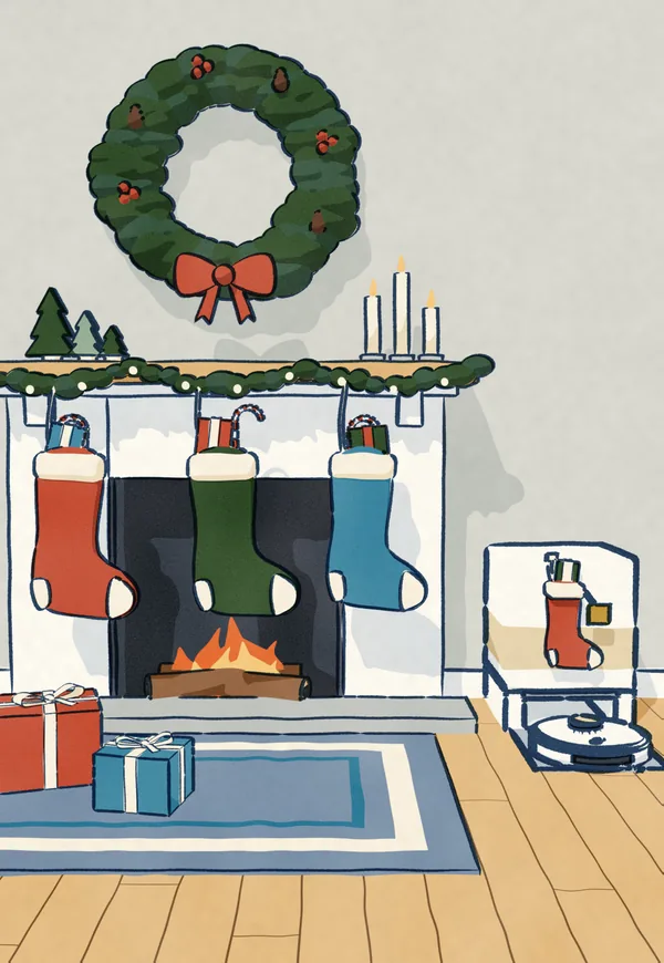 Three stockings on a mantel over a lit fire, stuffed with candy canes and small presents. Beside the hearth a robot vacuum sits in its dock, with a small stocking of its own.