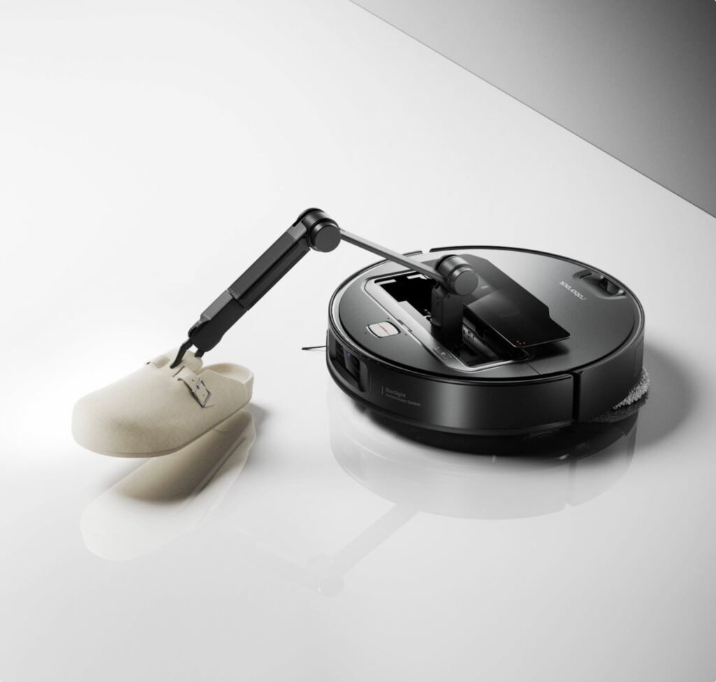 Roborock Saros Z70 robotic arm picking up a slipper