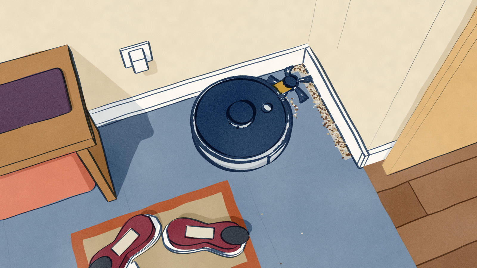 Seen from above in a hall, a round robot vacuum runs along the skirting board into the corner, its side brush swung out on an arm past the body to sweep grit out of the corner, while a line of grit still waits along the next wall and a pair of trainers lies kicked off on the doormat.