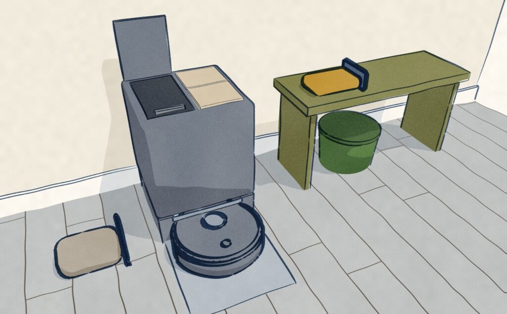 In a hall nook, a robot vacuum sits docked while its dock stands open: the full dust bag lies on the floor and a new bag waits on the hall bench to go in.
