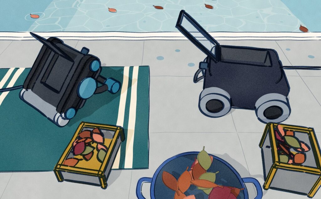 On the paving beside a pool, a pool robot lies upside down on a towel with its bottom hatch open and its leaf bag pulled out, while a second robot stands with its clear lid raised and its canister of leaves lifted out of the top.