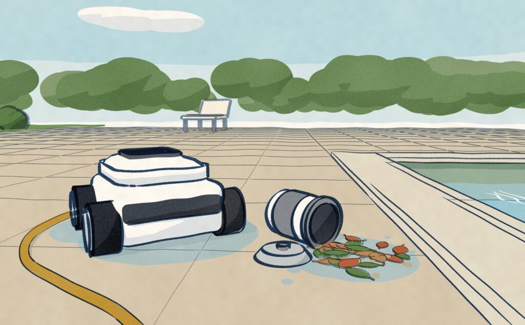 After its run, a white pool robot on big grey wheels sits on the wet deck paving beside the pool with its canister bay open, its small white filter canister tipped on its side next to it with the lid open, the leaves it caught and its water spilling onto the paving.