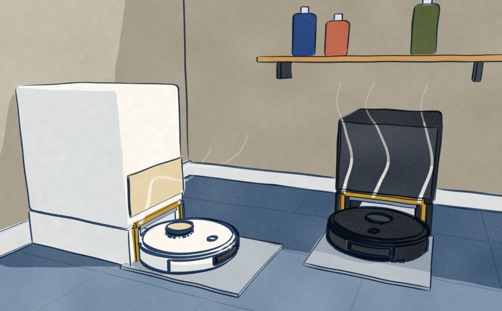 In a utility corner, a black robot vacuum sits backed into its black dock on one wall and a white robot sits in its tall white dock on the other, both docks washing the mops in hot water, steam rising off both wash trays.