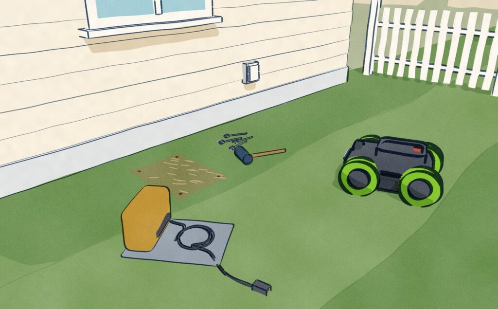 Beside a garage wall, a robot mower waits on the lawn next to its only charging station, which has been pulled up and set down on the grass beside the flattened patch where it stood, its pegs and a mallet lying by it.