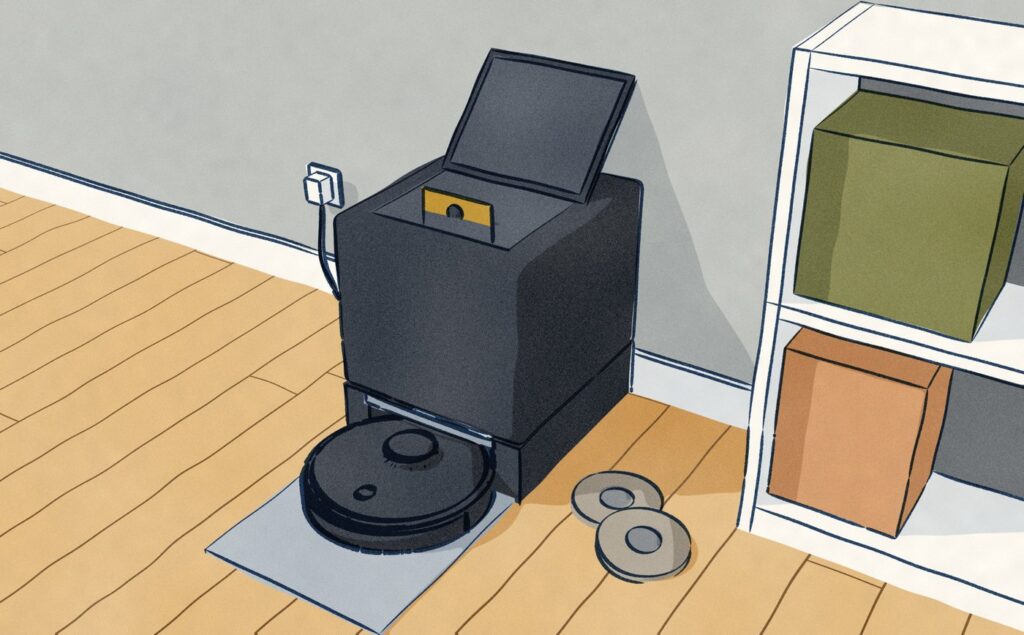 Back in its black dock and charging, the Roborock waits while the dock's lid stands open, the new bag's gold collar seated in the hatch and the two used mop pads that came off lying flat on the boards beside it.