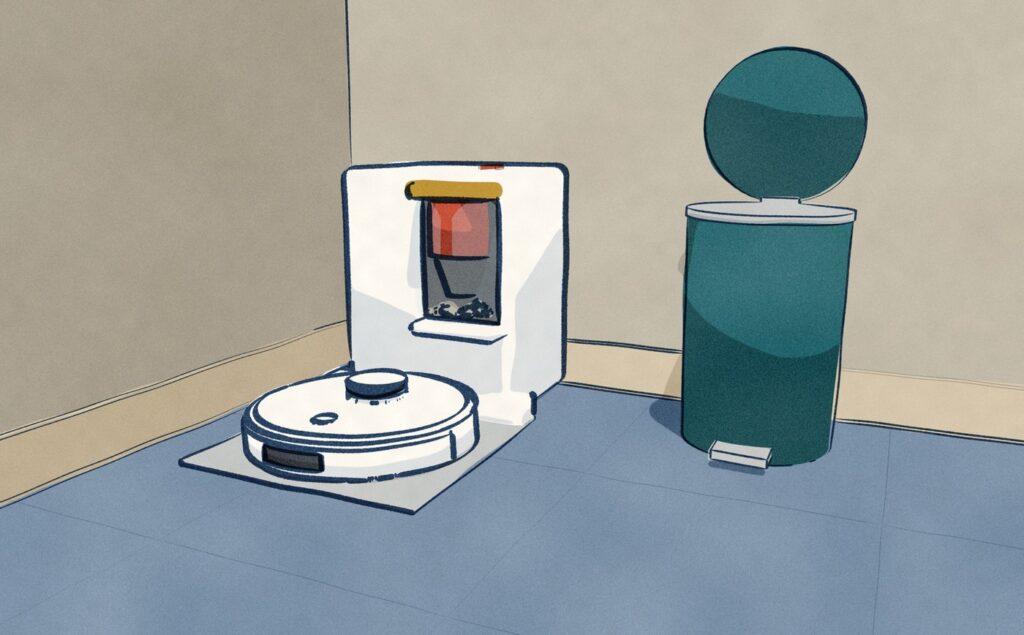 In the hall outside the laundry, the white Yeedi robot sits on its bagless dock, weeks of grey dust heaped in the clear bin under the red cyclone, and the household pedal bin stands open beside it, where the bin is tipped out by hand.